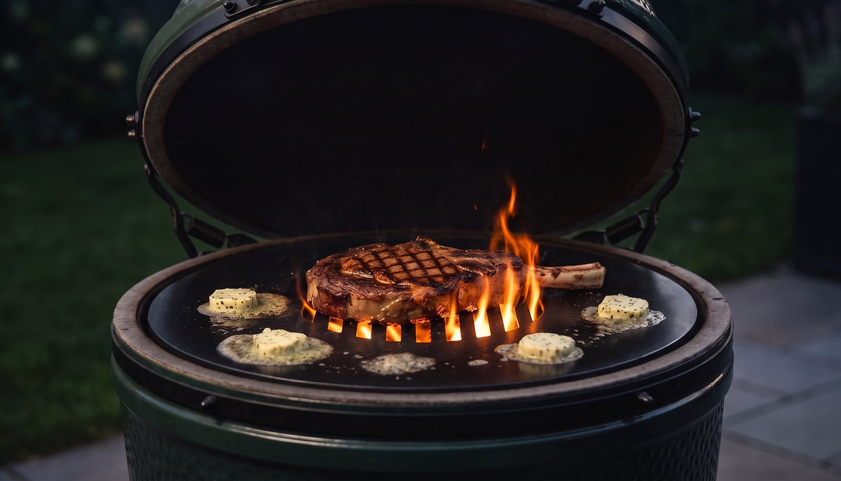 Bone-in ribeye searing over open flame on the Arteflame center grate in a kamado grill at dusk