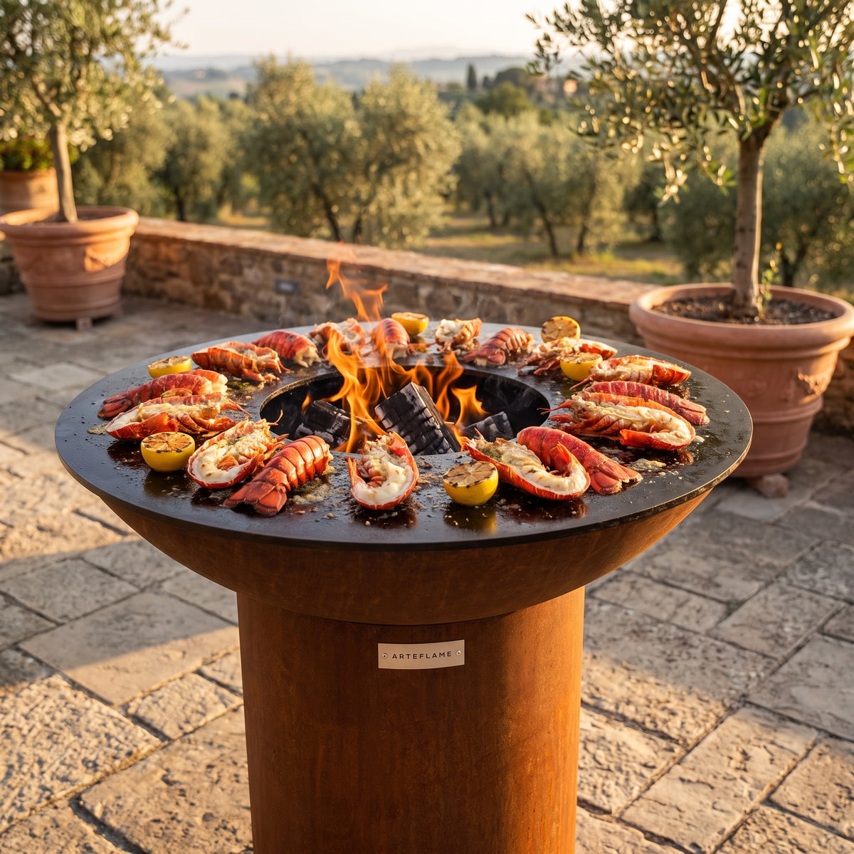 Arteflame wood-fired flat-top grill with round Corten steel base: Grill Lobster Tails