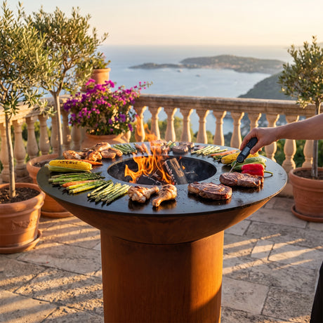 Arteflame wood-fired flat-top grill with round Corten steel base: Stop Overcooking Meat