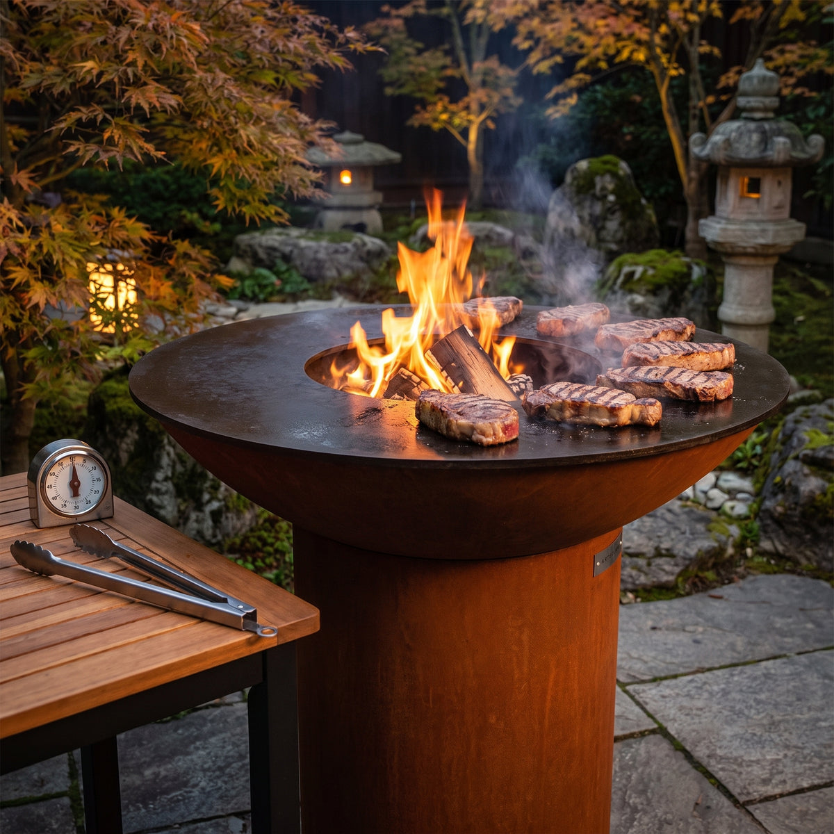 Arteflame wood-fired flat-top grill with round Corten steel base: How Long to Grill a Steak