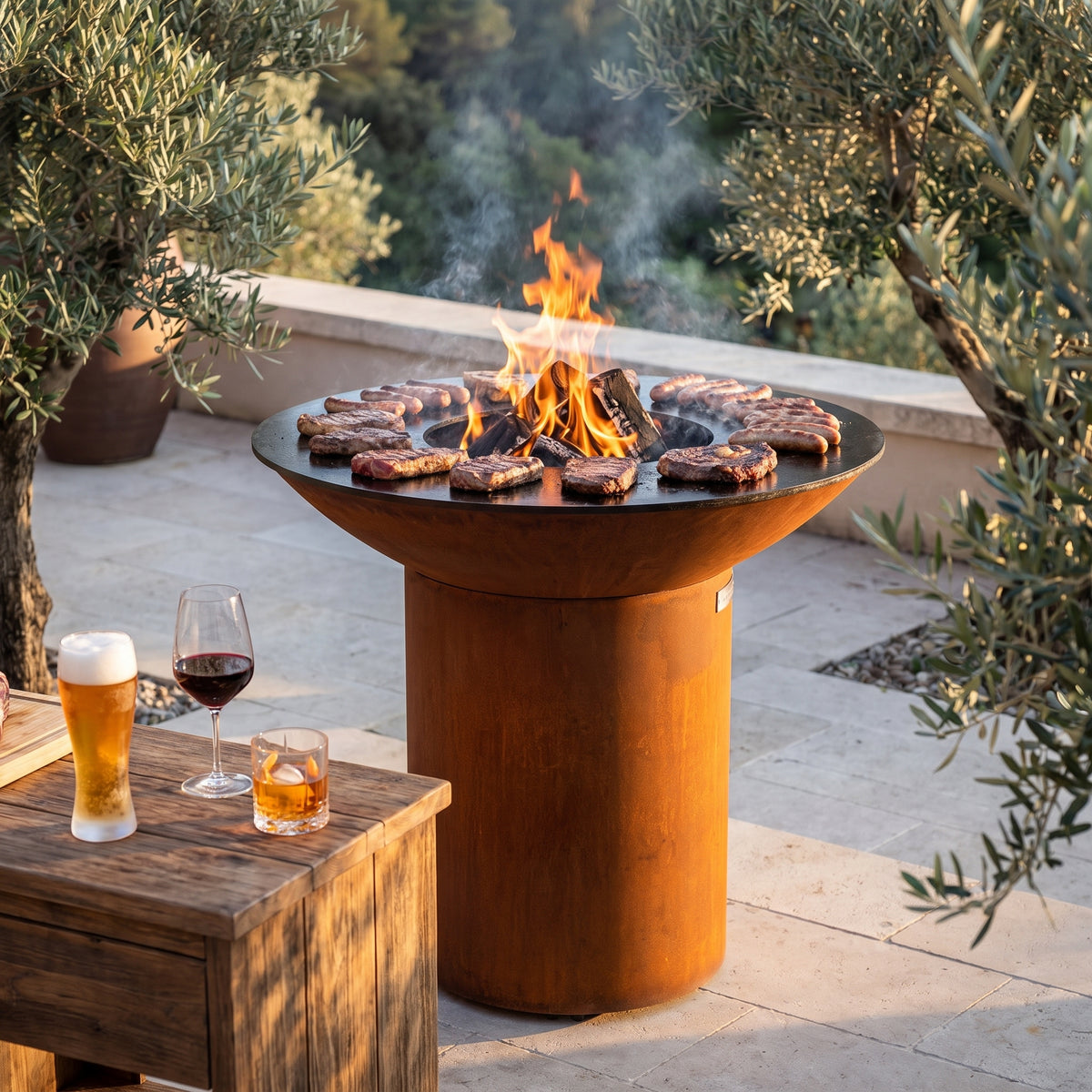 Arteflame wood-fired flat-top grill with round Corten steel base: Best Drinks for Grilled Meat