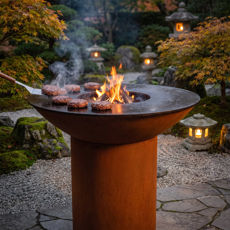 Arteflame wood-fired flat-top grill with round Corten steel base: Stop Burgers Falling Apart