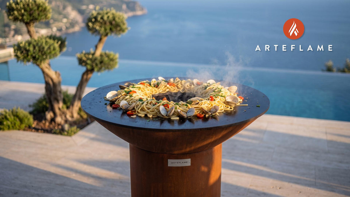 Grilled Linguine with Clams and Cherry Peppers cooking on an Arteflame grill