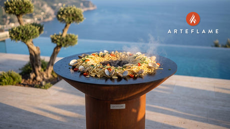 Grilled Linguine with Clams and Cherry Peppers cooking on an Arteflame grill