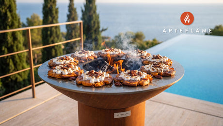 Grilled Yam Smash with Candied Pecans & Marshmallows cooking on an Arteflame grill