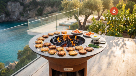 Crispy Potato Pancakes with Smoked Salmon & Caviar cooking on an Arteflame grill