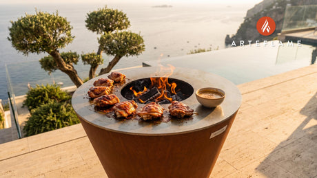 Grilled BBQ Chicken Thighs with Peanut Sauce cooking on an Arteflame grill