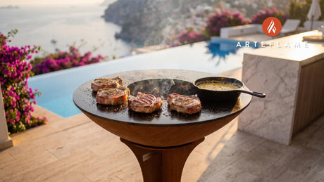 Juicy Grilled Pork Chops with Gruyère Sauce cooking on an Arteflame grill