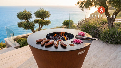 Grilled Beef Sausage & Pickled Onions (Swedish Style) cooking on an Arteflame grill