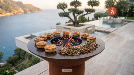 Grilled Scotch Pie with Caramelized Onions cooking on an Arteflame grill