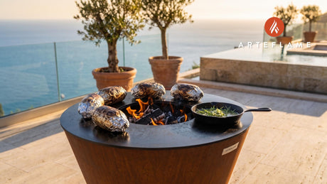 Charcoal Baked Potatoes (Swiss Herb Style) cooking on an Arteflame grill