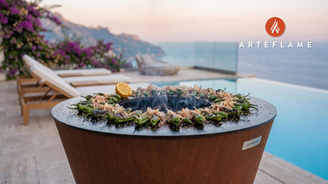 Charred Shishito Peppers with Bonito Flakes cooking on an Arteflame grill