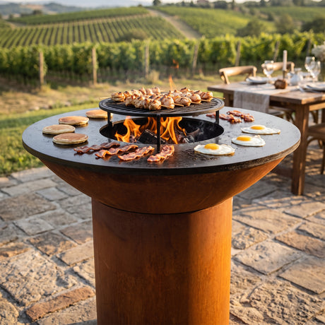 Arteflame wood-fired flat-top grill with round Corten steel base: Stainless Grates vs Carbon Steel