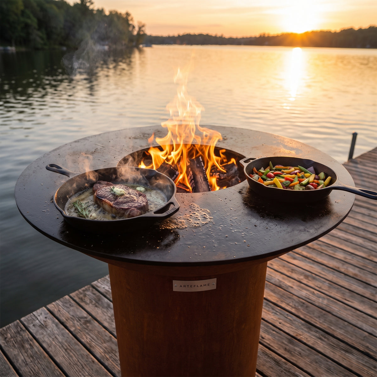 Arteflame wood-fired flat-top grill with round Corten steel base: Skillet Grills