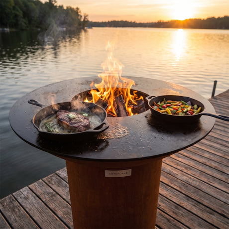 Arteflame wood-fired flat-top grill with round Corten steel base: Skillet Grills