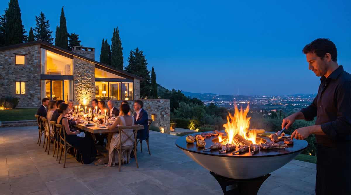 Host grilling lamb chops on the Arteflame 40-inch Platinum Series stainless steel grill at an evening garden dinner party