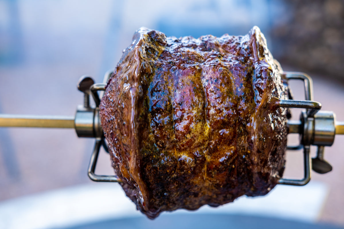 Versatile rotisserie cooking on a grill.